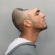 Illustration for article titled Half-Headed Man Takes World's Most Bizarre Mugshot
